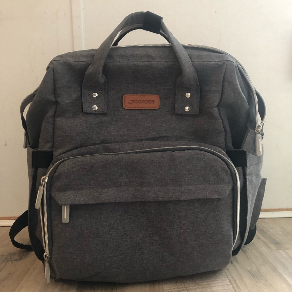 3-in-1 diaper bag backpack with changing station/bassinet